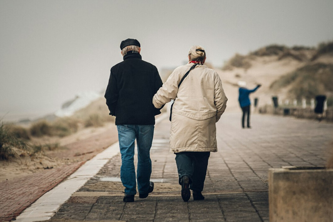 Elderly couple walking together